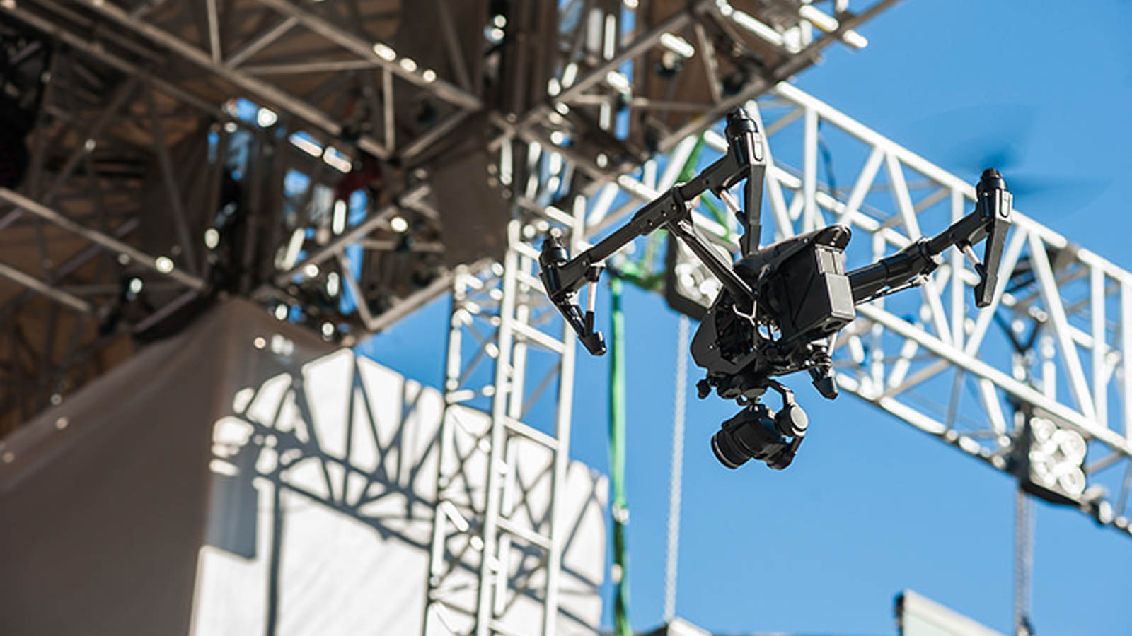 Вrone on stage background/Drone with camera hovers over the sta