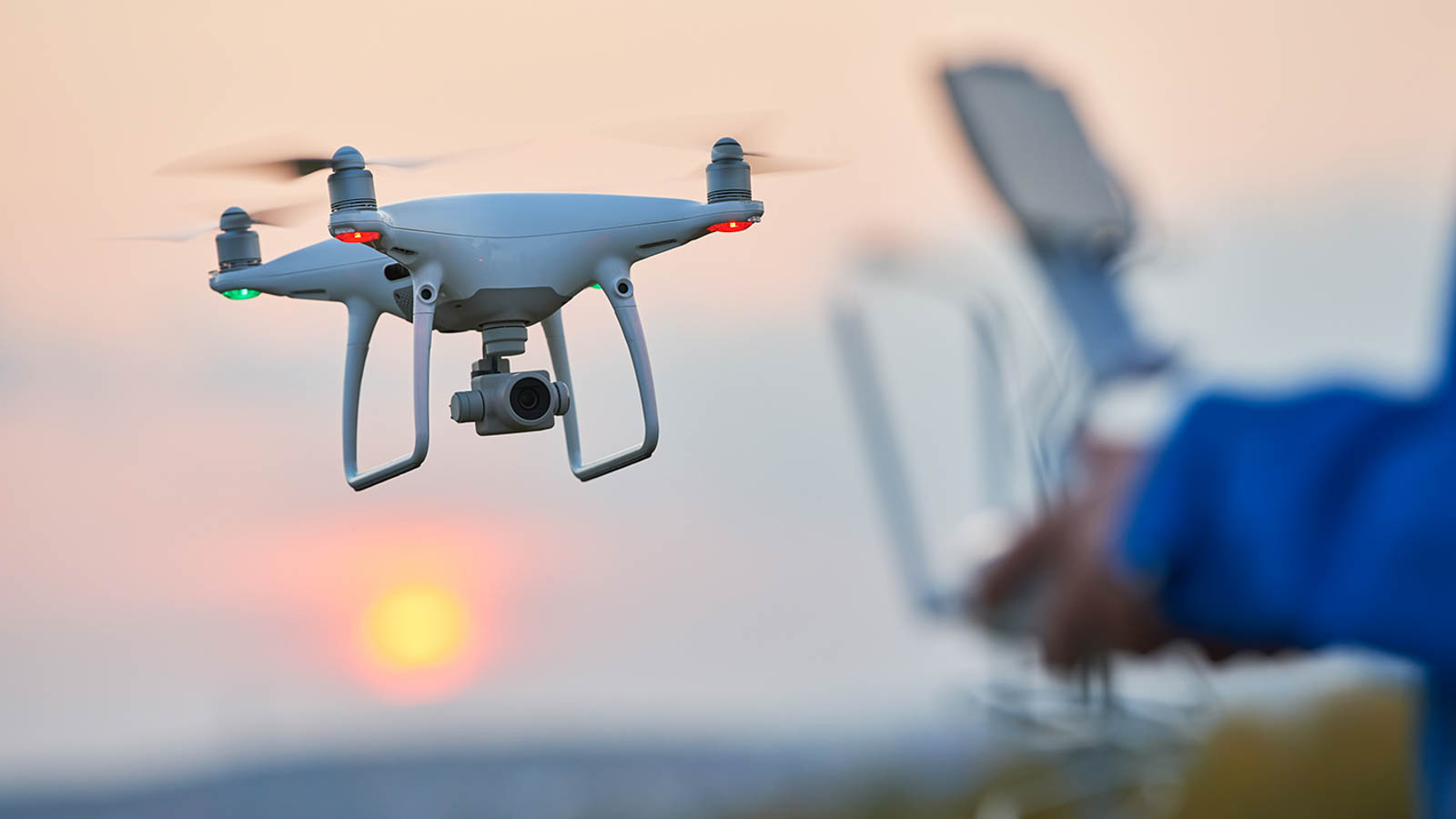 drone flying and operated by remote controlsunset
